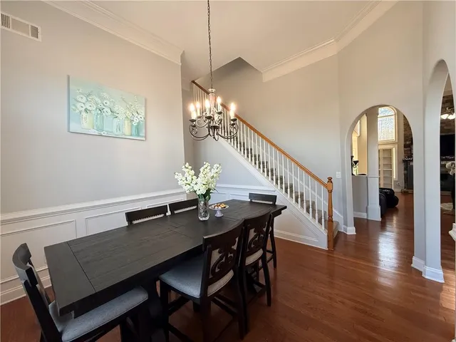 a large kitchen with stainless steel appliances granite countertop a stove and a sink