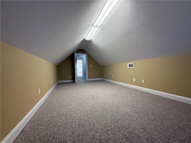 a view of house with yard