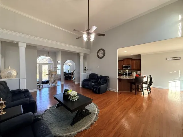 a bed room with furniture and a ceiling fan