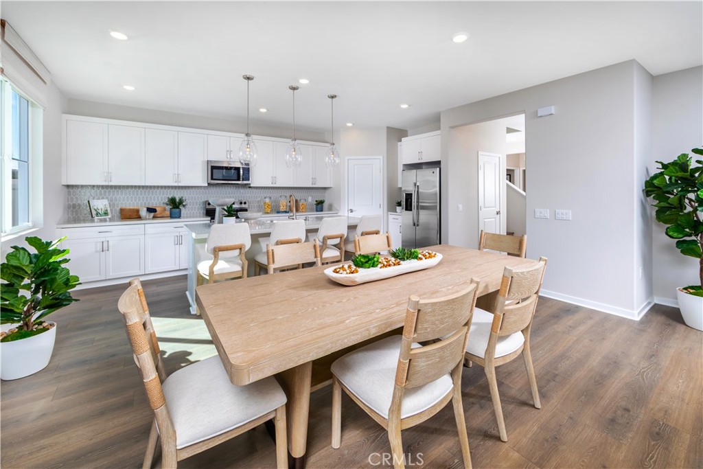 9535 Silverstein Drive Riverside, CA 92508 - Photo 4 of 11 a view of a dining room with furniture window and wooden floor