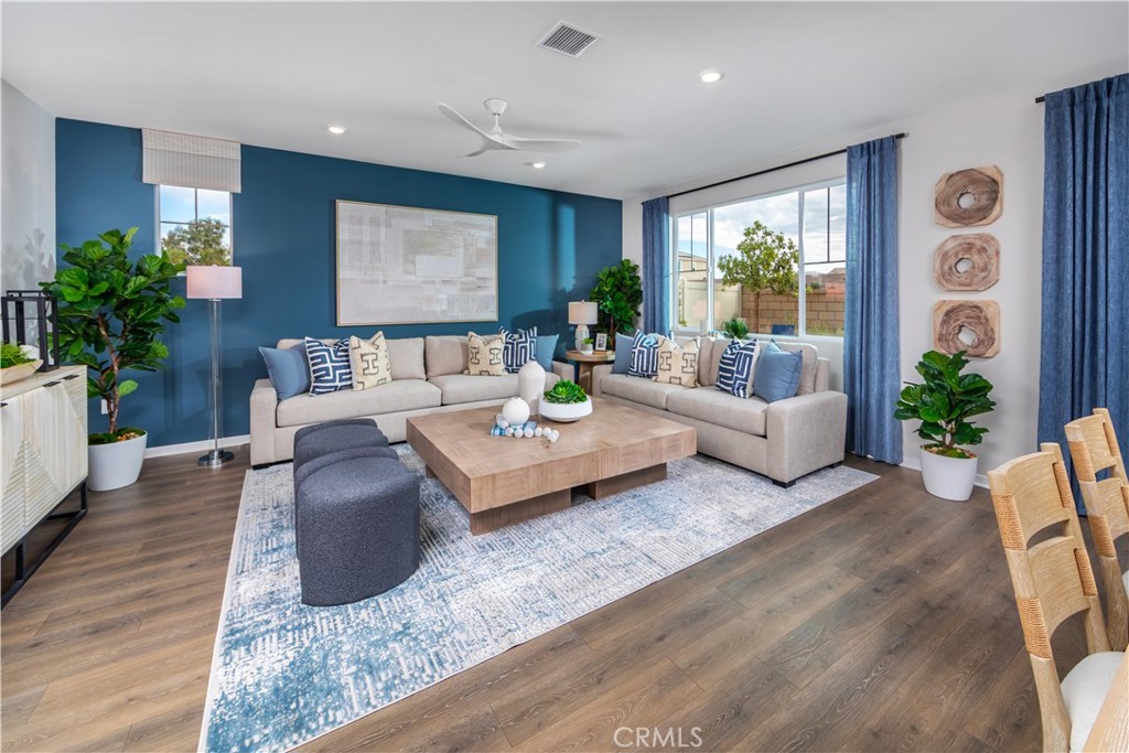 9535 Silverstein Drive Riverside, CA 92508 - Photo 5 of 11 a living room with furniture potted plant and a window