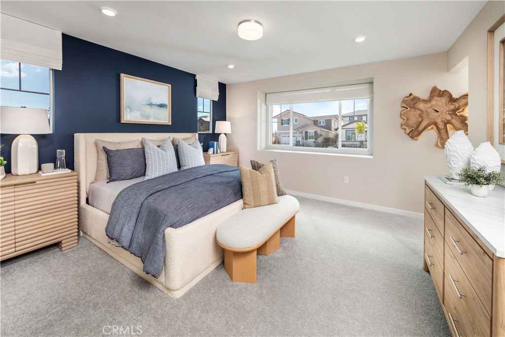 9535 Silverstein Drive Riverside, CA 92508 - Photo 6 of 11 a spacious bedroom with a bed and a large window