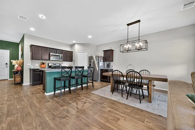 a bedroom with a bed and a flat tv screen