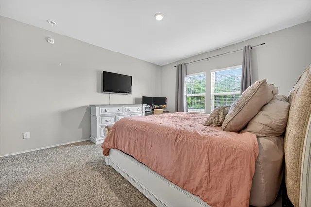 a bathroom with a sink vanity mirror and toilet