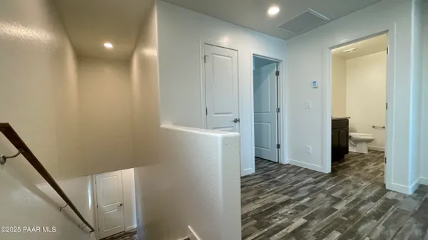 a view of entryway with wooden floor