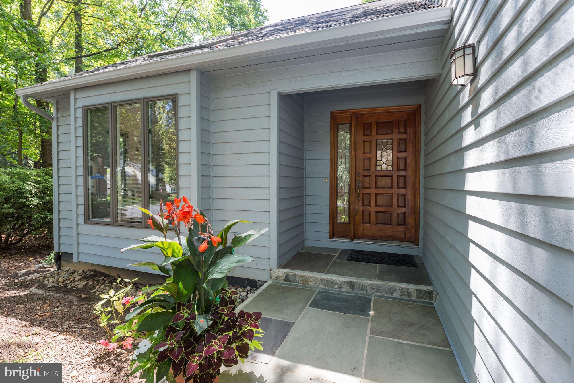 11593 Lake Newport Road Reston, VA 20194 - Photo 3 of 82 Covered entry with warm wood, elegant slate