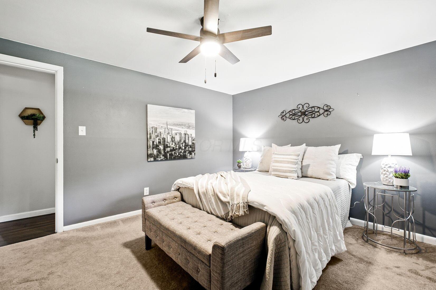 3216 Polley Road Columbus, OH 43221 - Photo 18 of 45 Spacious main bedroom with ceiling fan and neutral tones.