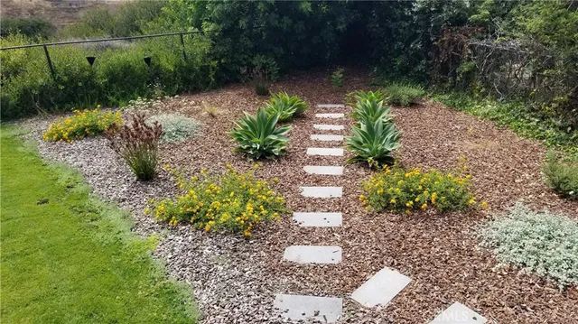 a view of a city with lush green forest