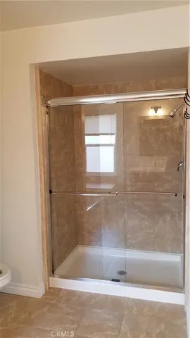 a bathroom with a tub a sink and mirror