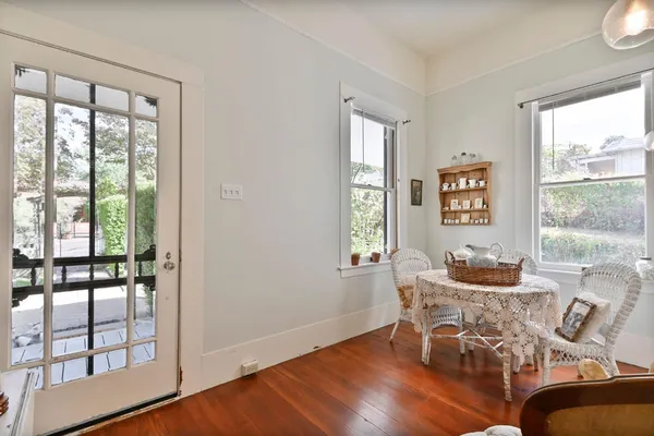 a living room with furniture or couch and a wooden floor