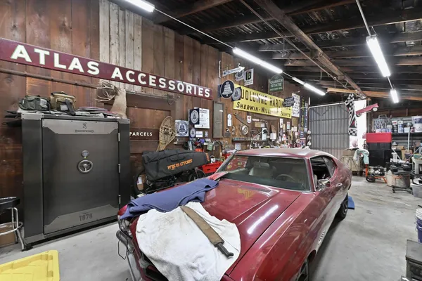 a backyard of a house with lots of green space and fountain