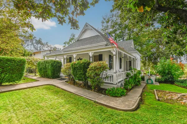 a front view of a house with garden