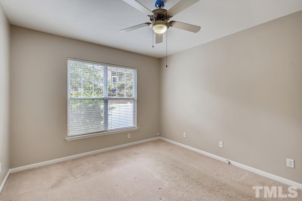 1258 Silver Beach Way Raleigh, NC 27606 - Photo 14 of 28 an empty room with a window and a fan