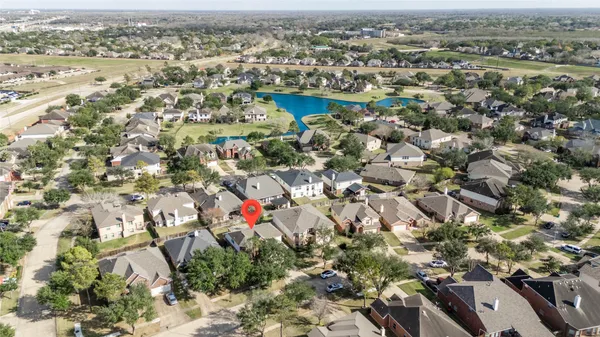 an aerial view of a house with a garden