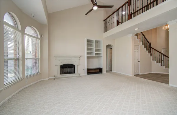 a kitchen with stainless steel appliances granite countertop a sink counter space cabinets and a large window