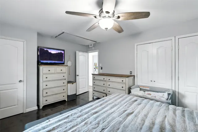 a bedroom with a bed and a table with chair