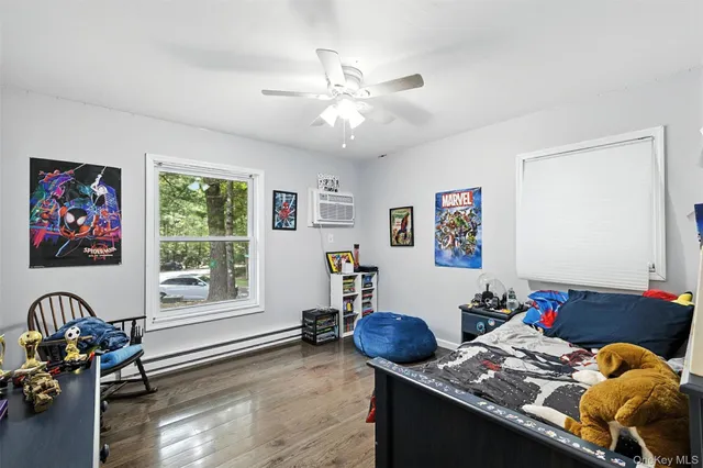 a room with a dresser and a chandelier