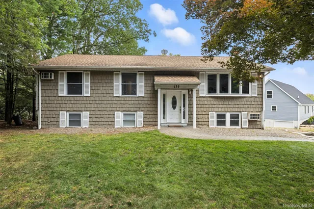 a view of a house with a yard