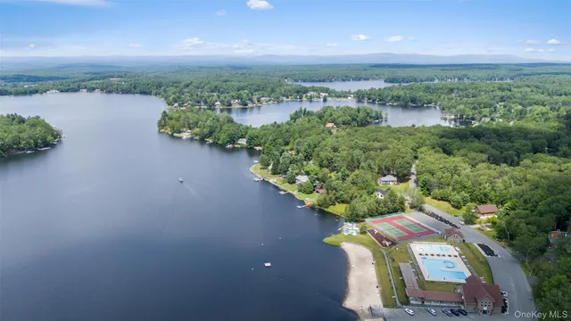 an aerial view of a house with a lake view