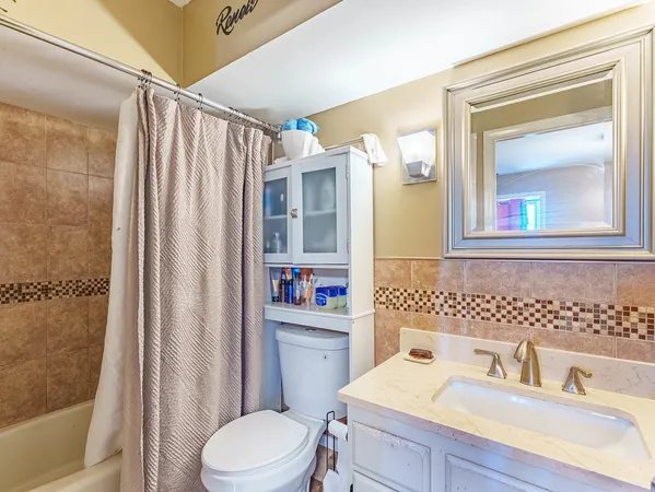 a bed room with a bed and a television