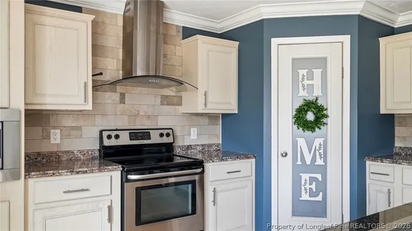 a kitchen with stainless steel appliances granite countertop a refrigerator a sink and dishwasher