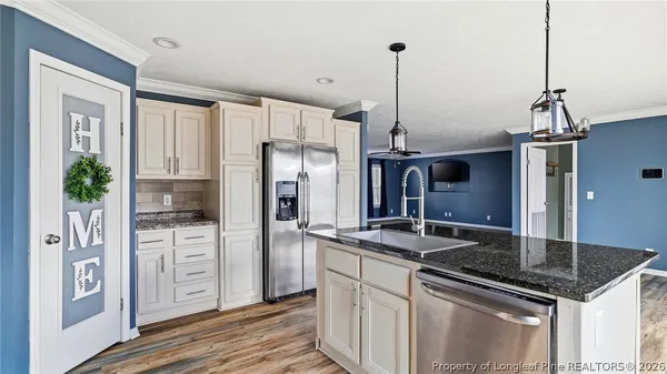 a bathroom with a granite countertop sink and vanity