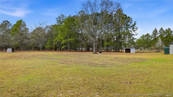 a backyard of a house with lots of green space