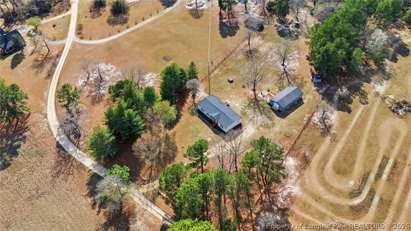 an aerial view of a house with a garden