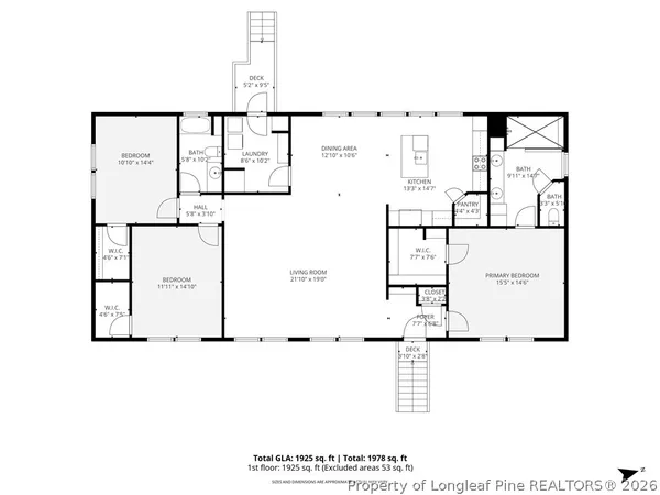 a view of an empty room with a ceiling fan