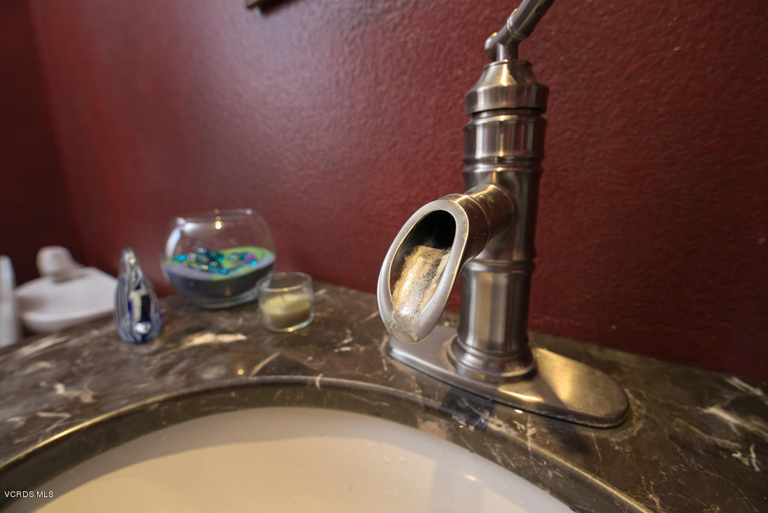349 Fresh Meadows Road Simi Valley, CA 93065 - Photo 14 of 30 a bathroom with a sink and a mirror