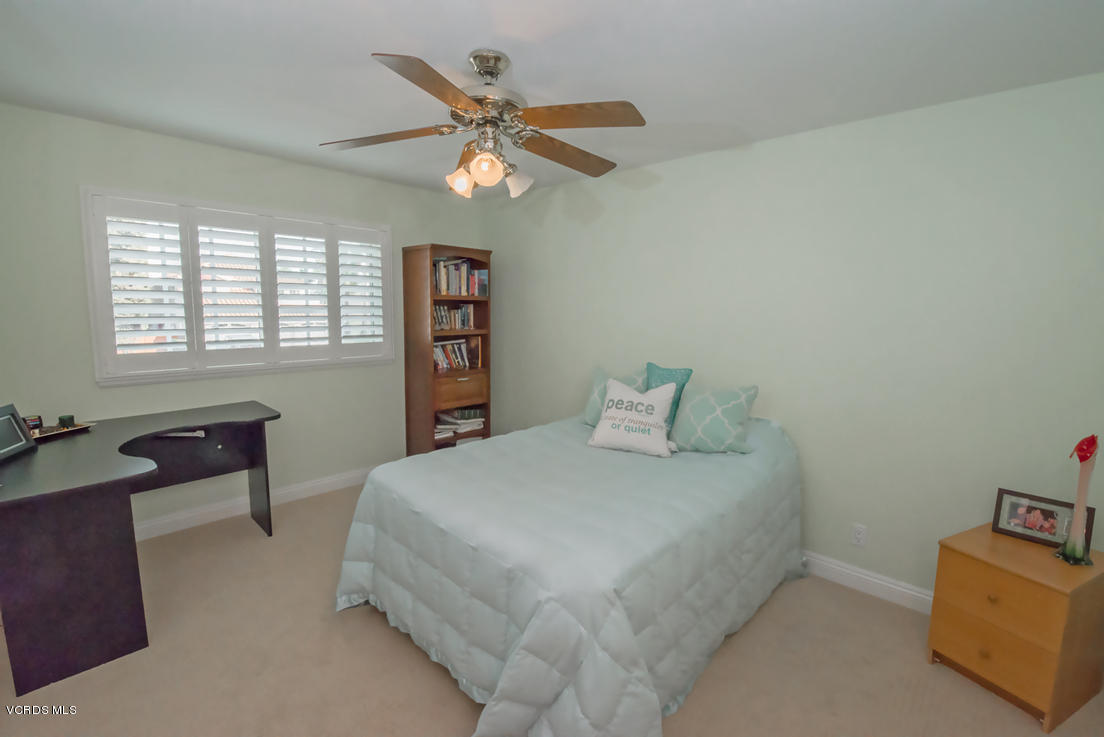 349 Fresh Meadows Road Simi Valley, CA 93065 - Photo 22 of 30 a bedroom with a bed and a chandelier
