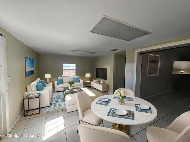 a view of a dining room with furniture