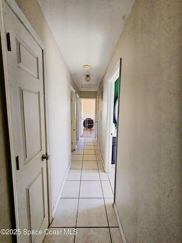 a view of a hallway view with staircase