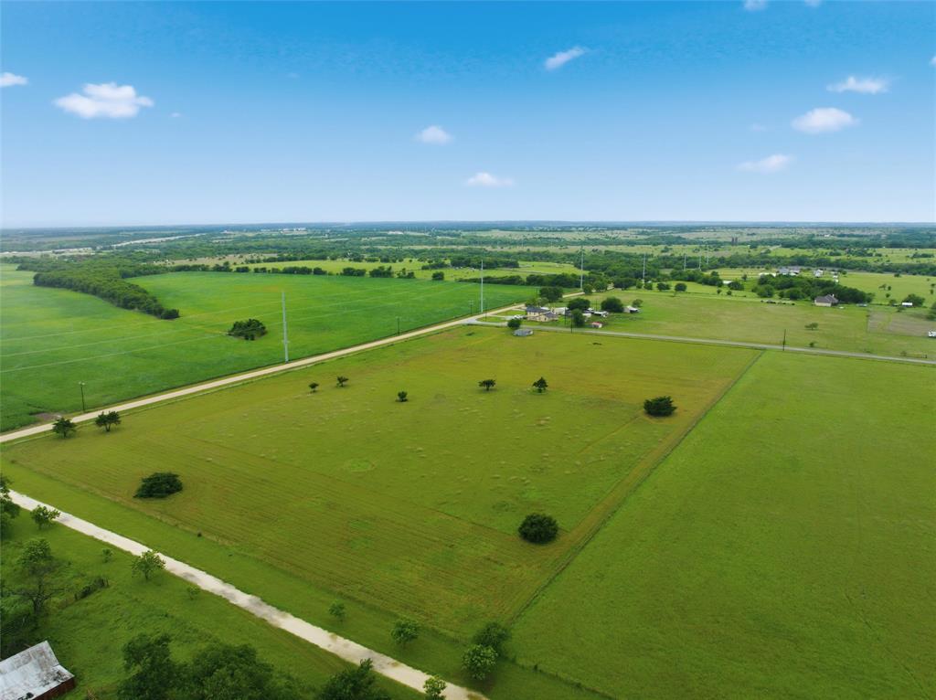Tbd Wade Road Eddy, TX 76524 - Photo 12 of 12 Expansive rural property featuring multiple green pastures, scattered mature trees, and visible clear sky