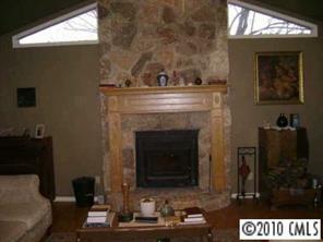 3129 Sikes Mill Road Monroe, NC 28110 - Photo 2 of 8 a living room with furniture and a fireplace