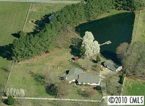 3129 Sikes Mill Road Monroe, NC 28110 - Photo 8 of 8 an aerial view of a residential houses with outdoor space