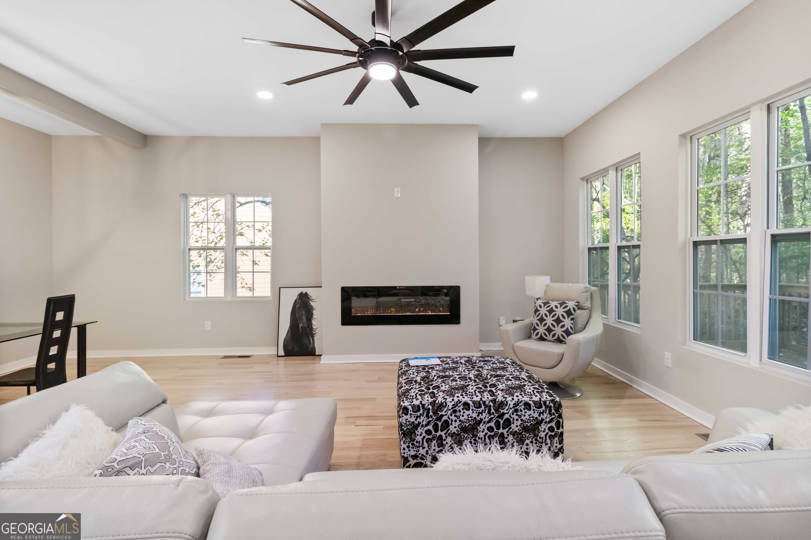 6960 Dockbridge Way Stone Mountain, GA 30087 - Photo 17 of 61 a bedroom with a large bed and a couch
