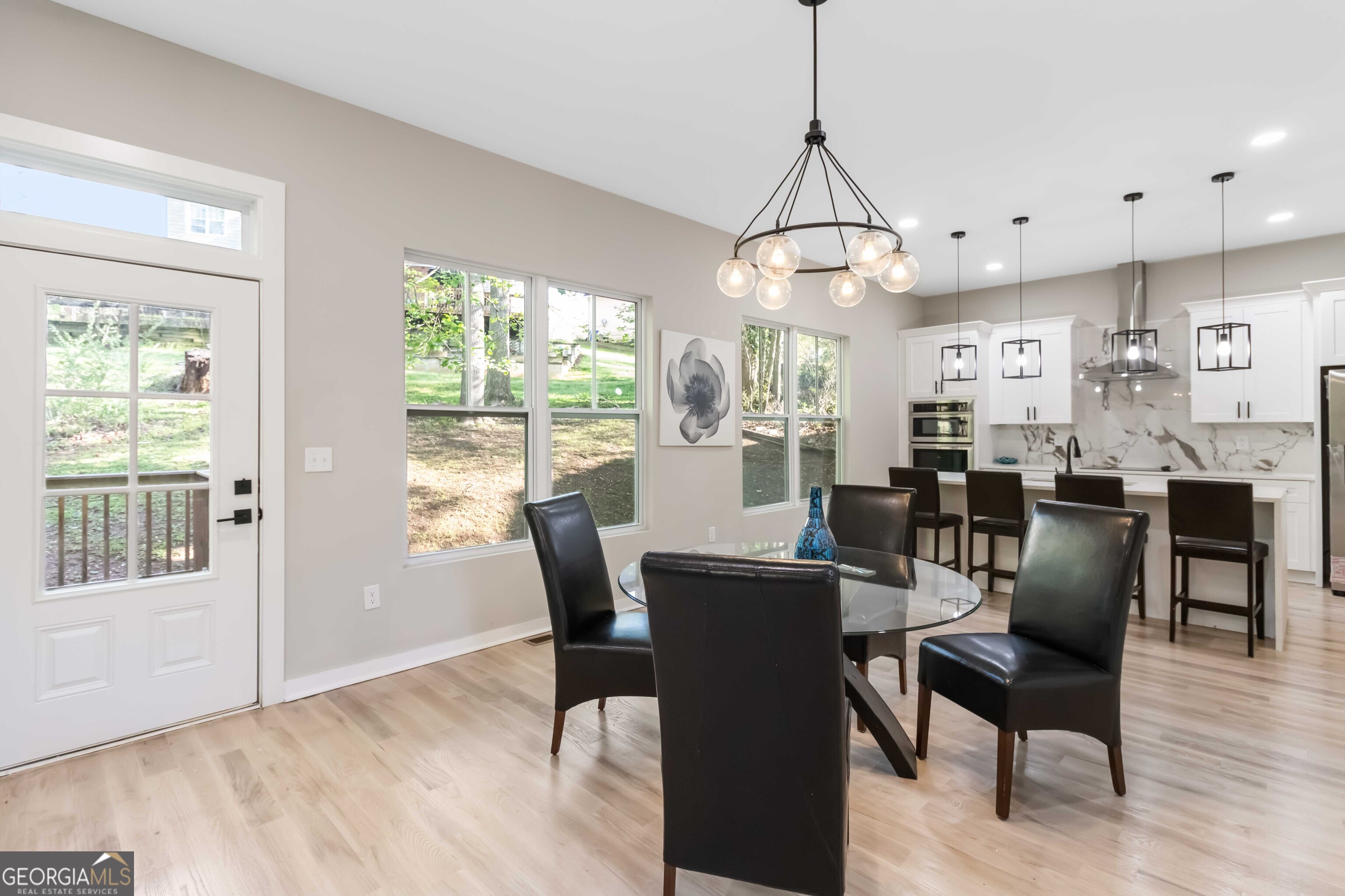 6960 Dockbridge Way Stone Mountain, GA 30087 - Photo 24 of 61 a view of a dining room with furniture window and outside view