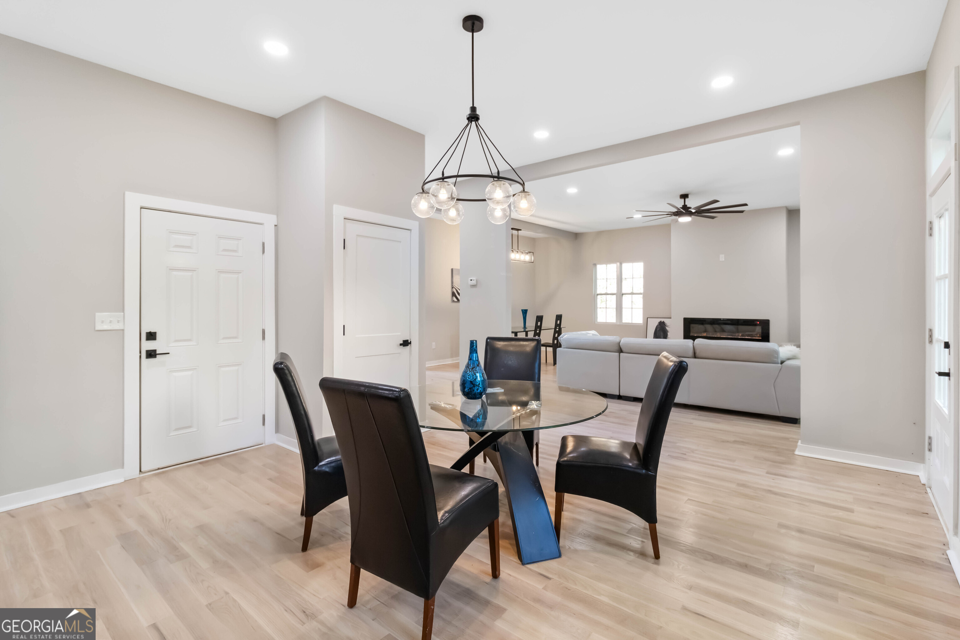 6960 Dockbridge Way Stone Mountain, GA 30087 - Photo 26 of 61 a view of a dining room with furniture and wooden floor