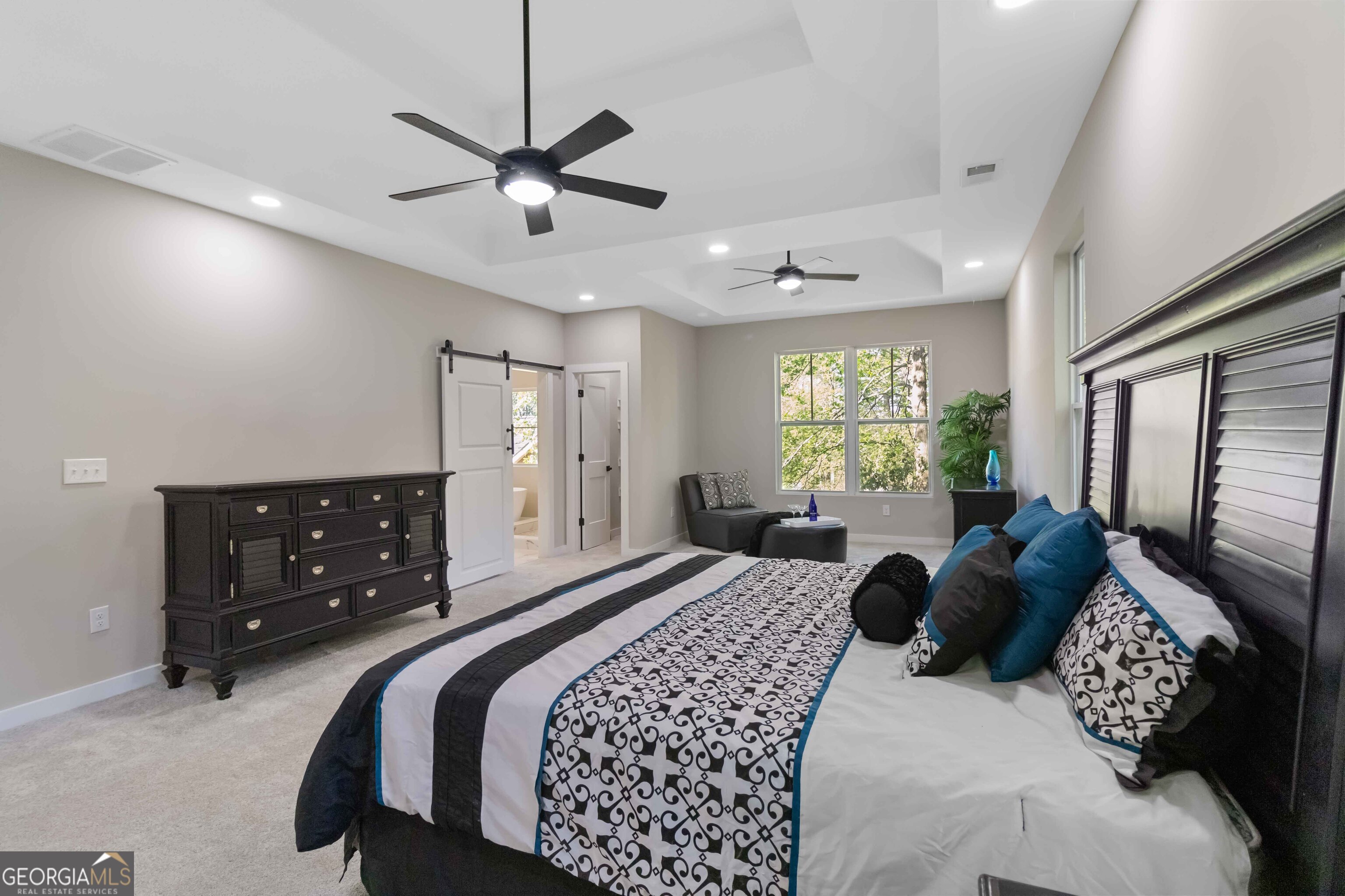 6960 Dockbridge Way Stone Mountain, GA 30087 - Photo 28 of 61 a bedroom with a bed couch and window