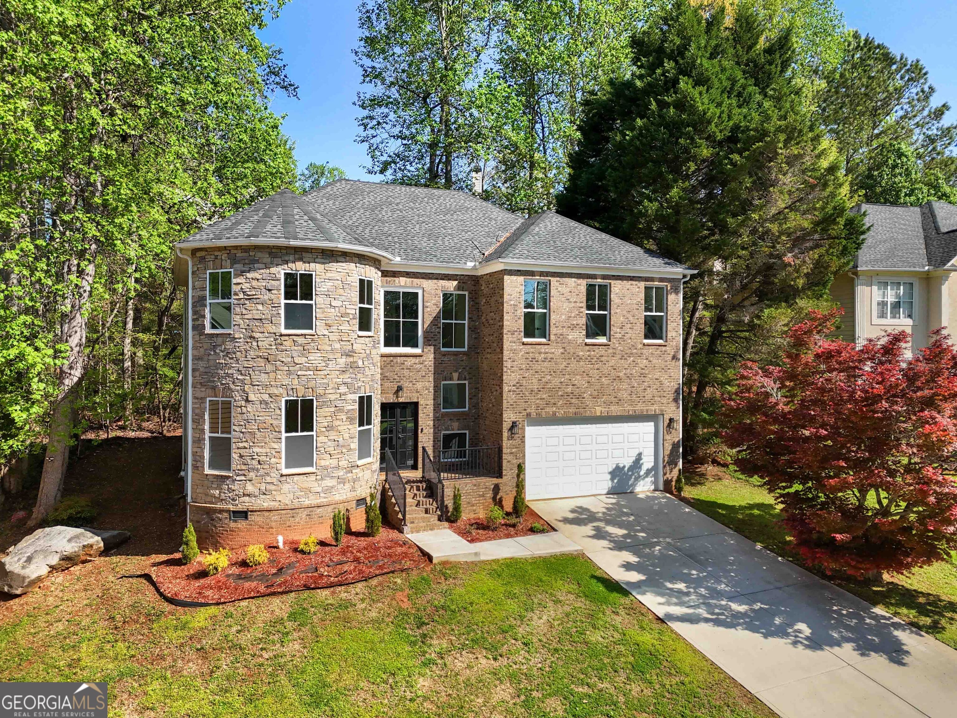 6960 Dockbridge Way Stone Mountain, GA 30087 - Photo 3 of 61 a front view of a house with a yard