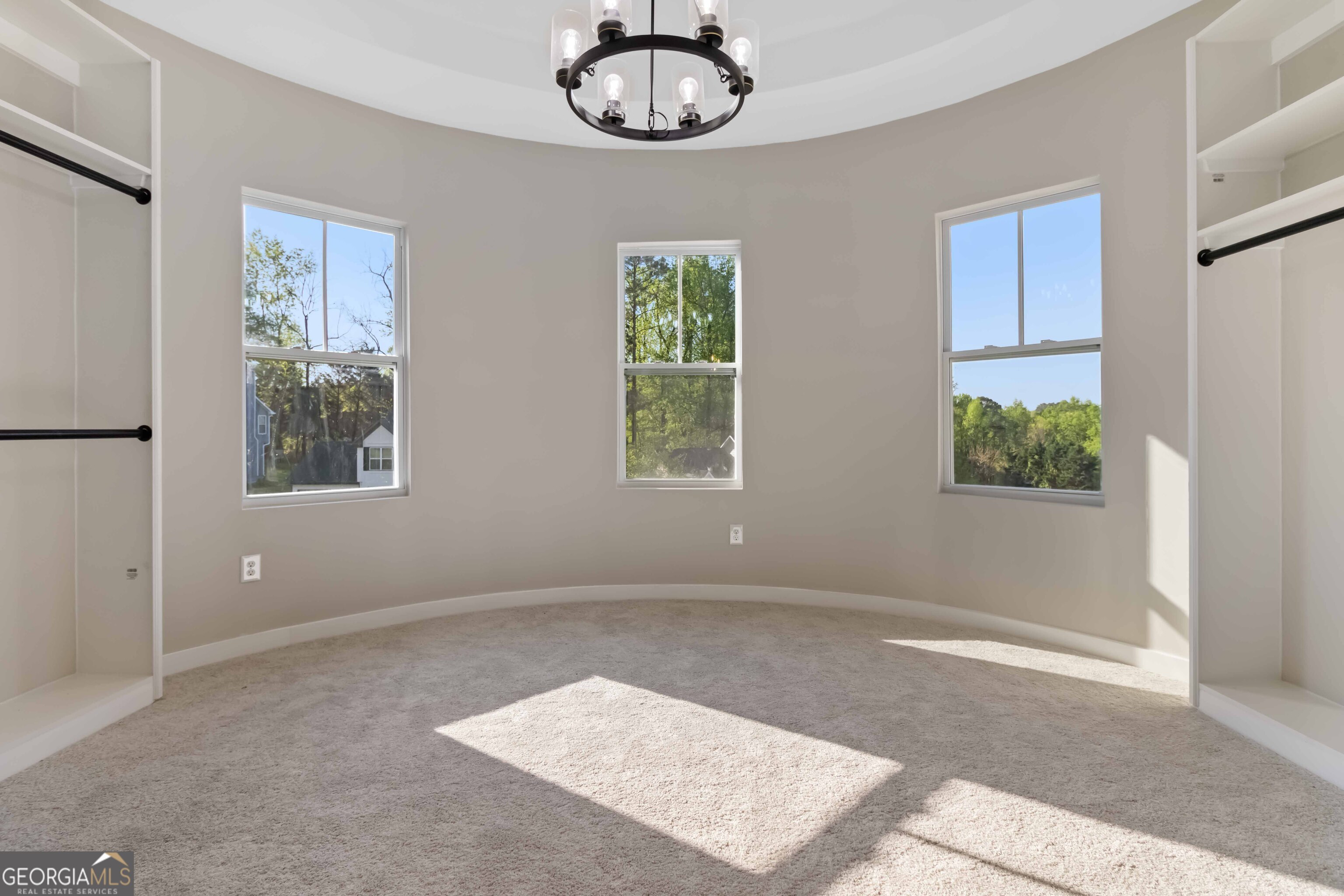 6960 Dockbridge Way Stone Mountain, GA 30087 - Photo 34 of 61 an empty room with windows and ceiling fan