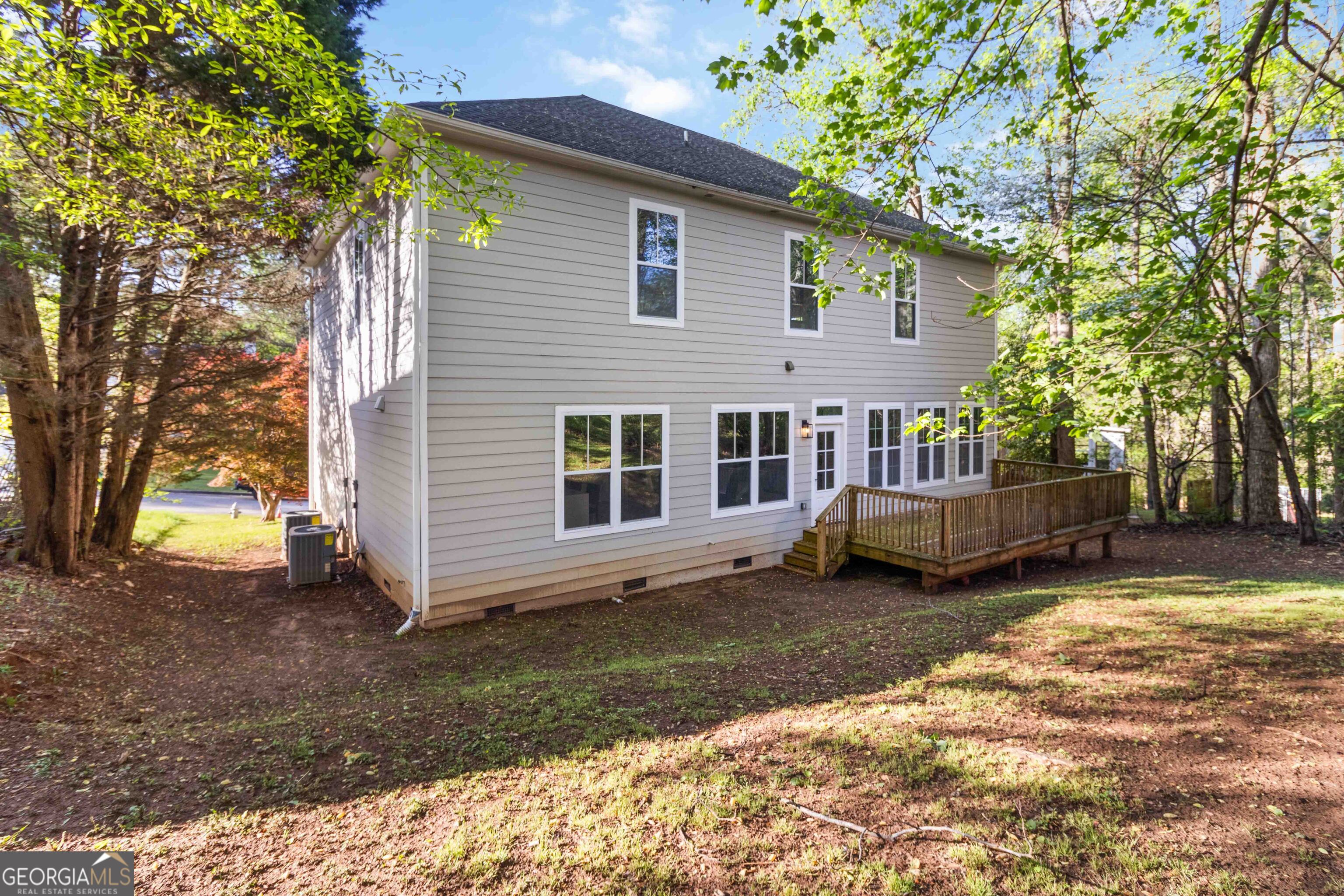6960 Dockbridge Way Stone Mountain, GA 30087 - Photo 52 of 61 a view of a house with a yard