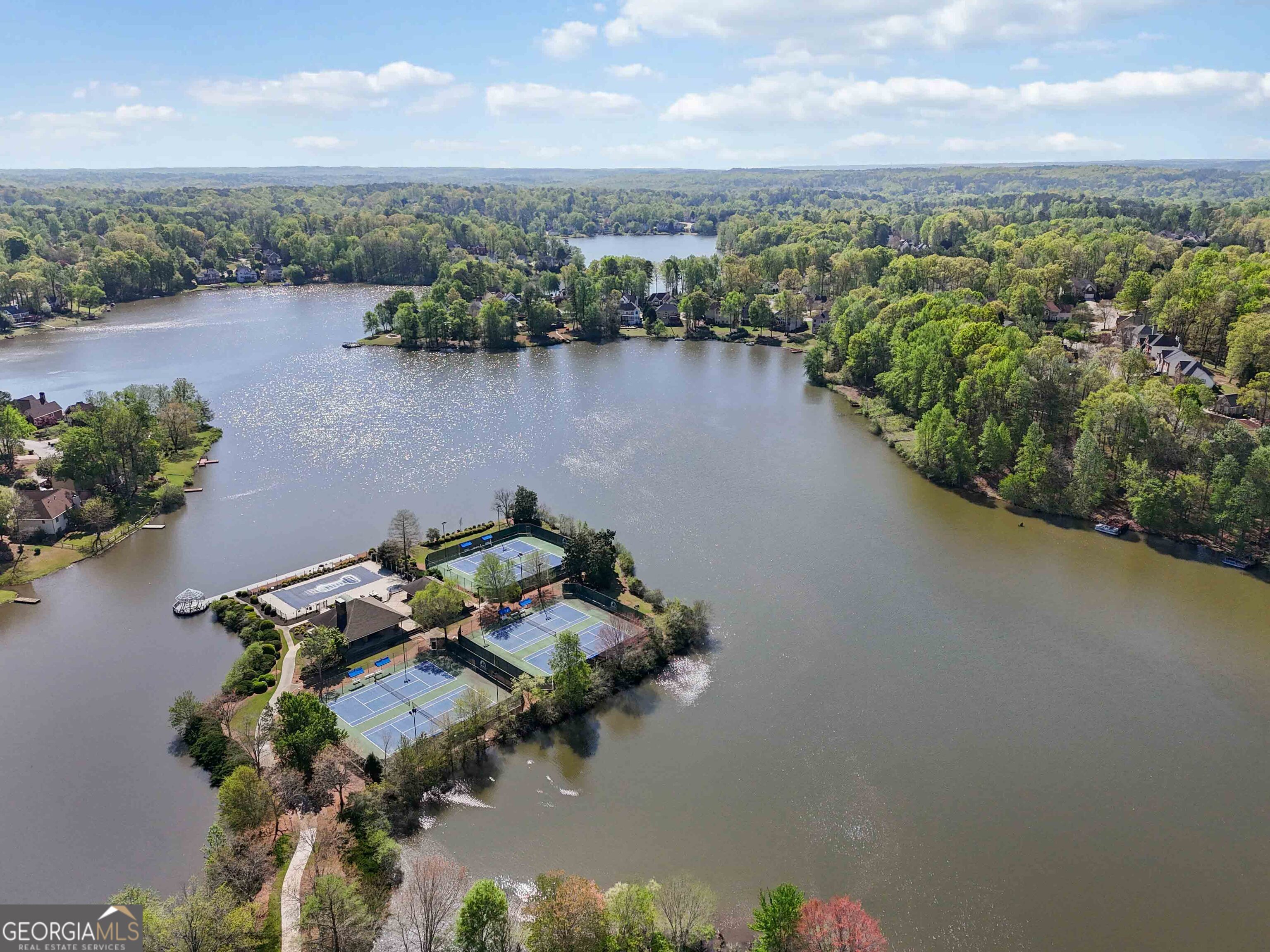 6960 Dockbridge Way Stone Mountain, GA 30087 - Photo 53 of 61 an aerial view of a house with a lake view