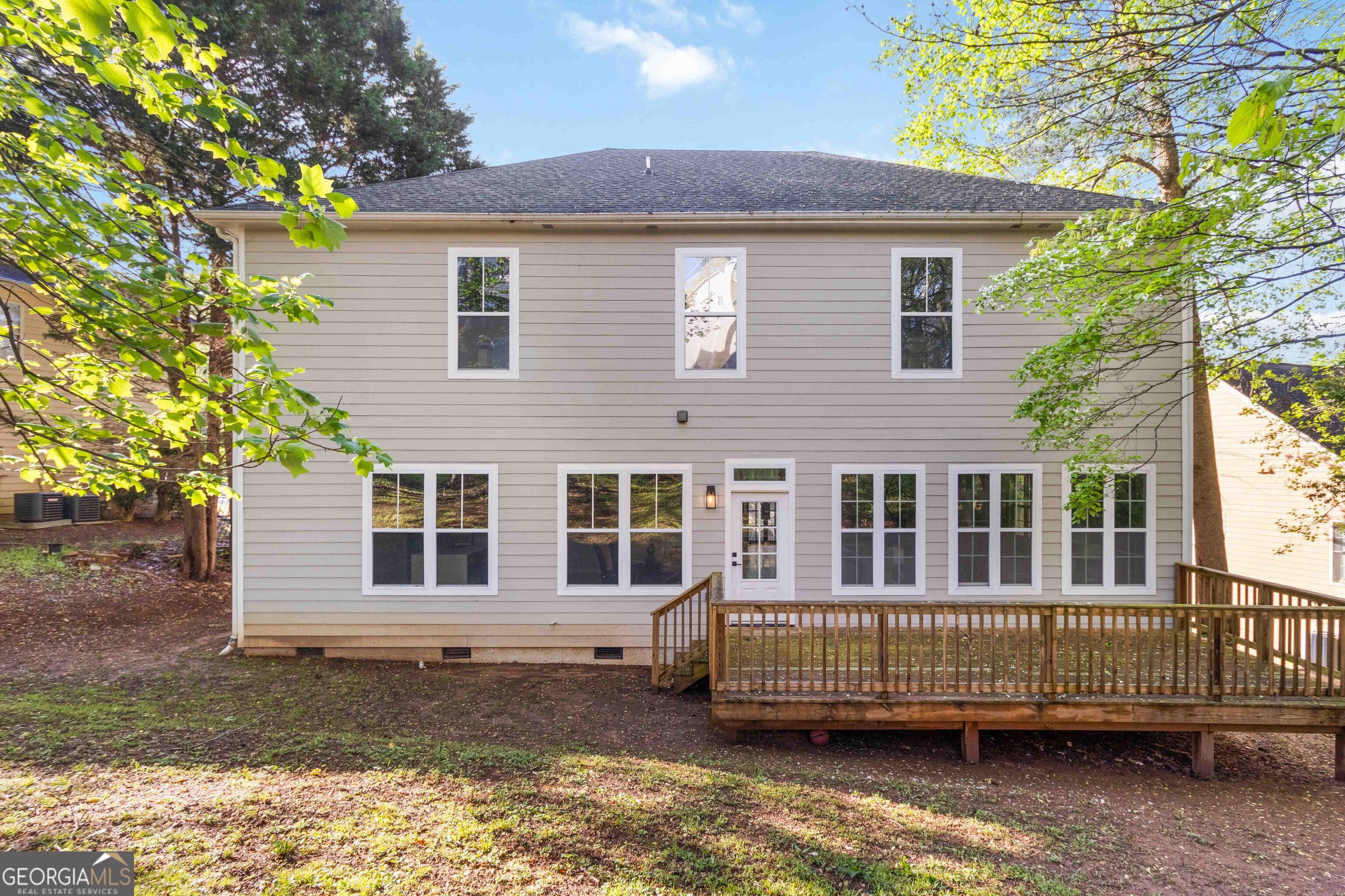 6960 Dockbridge Way Stone Mountain, GA 30087 - Photo 54 of 61 a view of a house with a yard