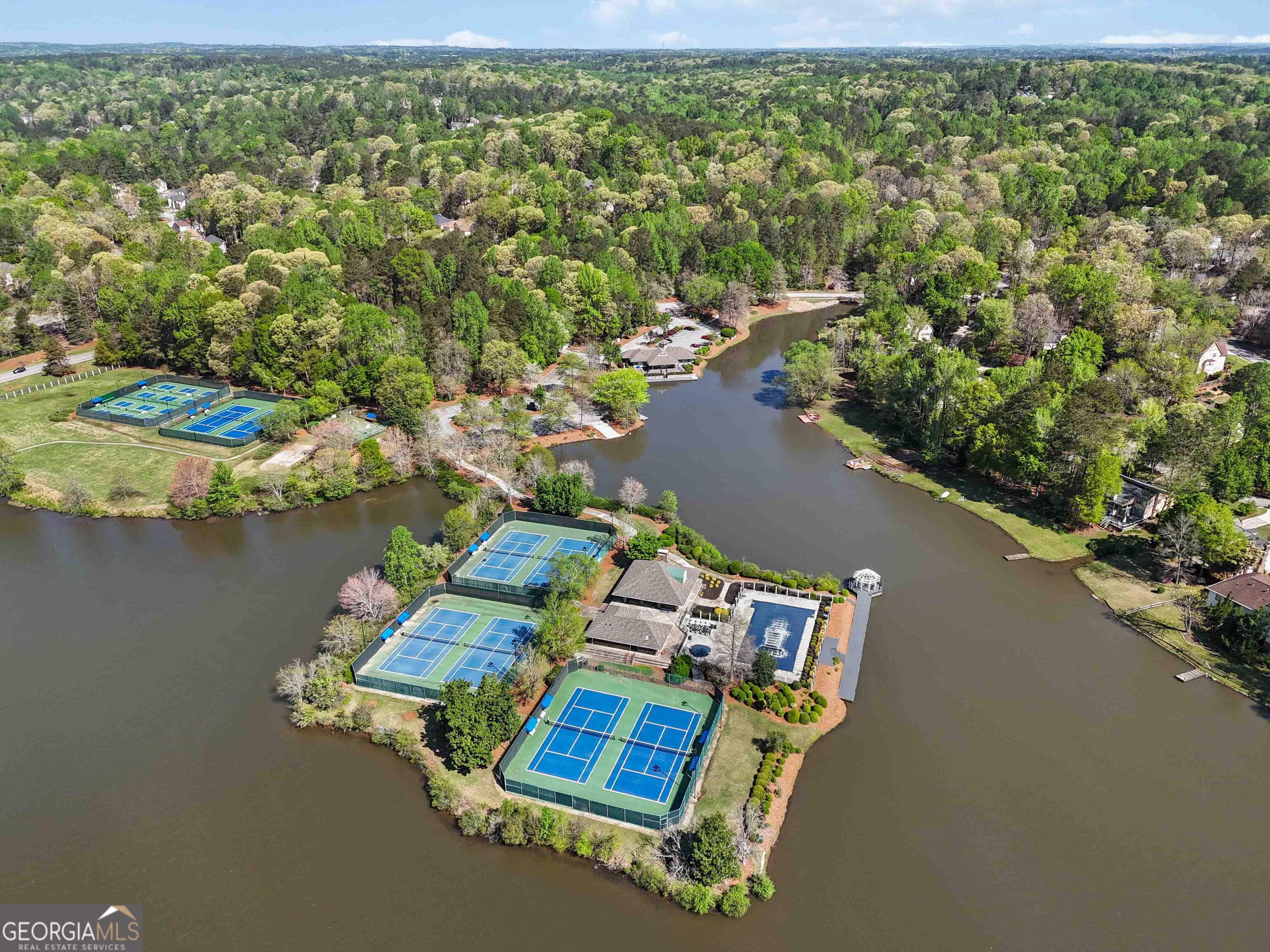 6960 Dockbridge Way Stone Mountain, GA 30087 - Photo 58 of 61 an aerial view of a house with a lake view
