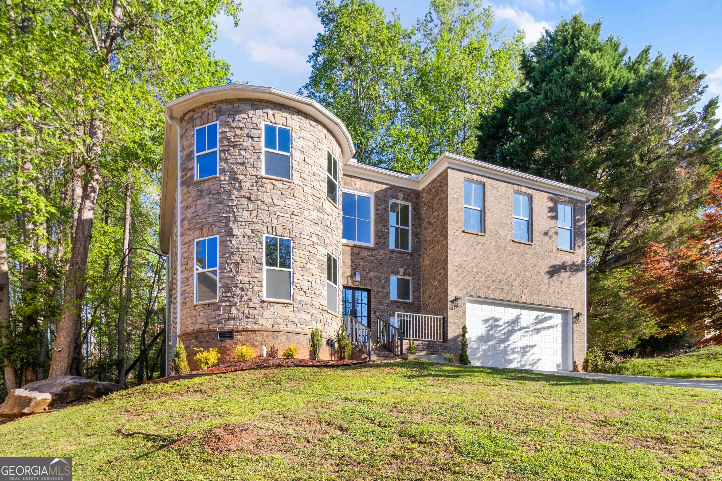 6960 Dockbridge Way Stone Mountain, GA 30087 - Photo 6 of 61 a front view of a house with a yard