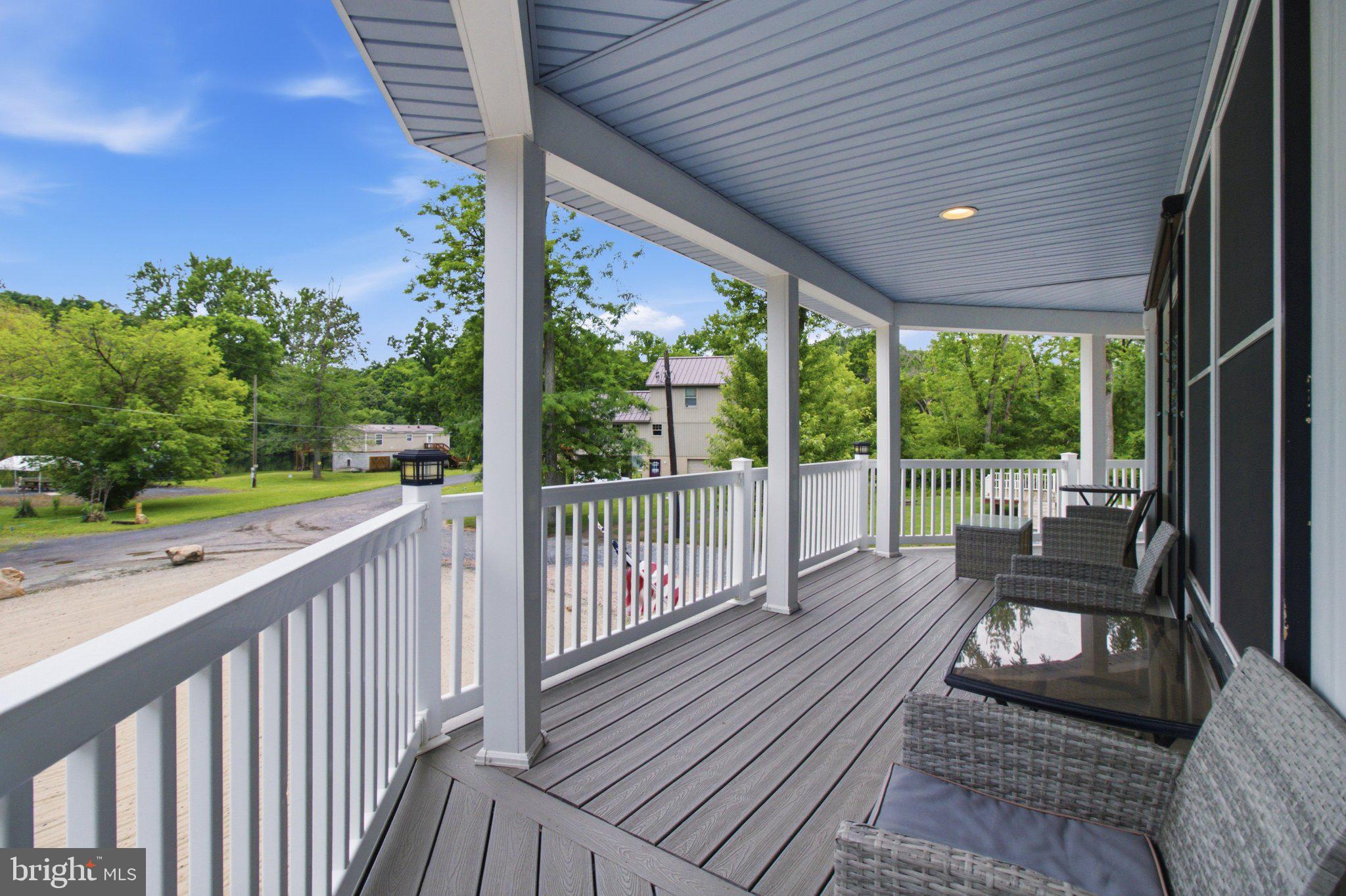 203 Front Drive Mount Union, PA 17066 - Photo 10 of 31 Serene porch with lush green views.