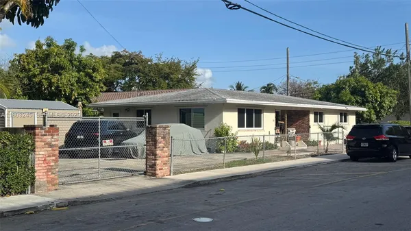 a view of a car park in front of house