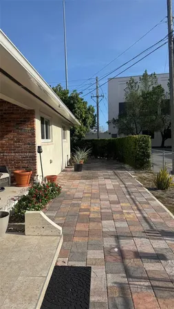 a view of a backyard with potted plants